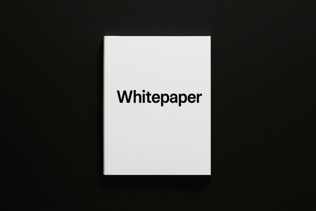 Livro branco com a palavra “Whitepaper” em destaque sobre fundo preto, simbolizando o documento técnico que explica projetos de criptomoedas e blockchain.